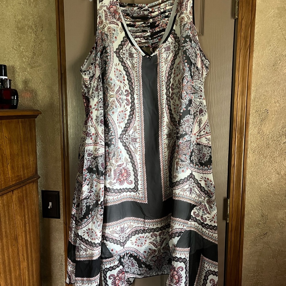 Shark bite sleeveless dress with v-neck back. Gently used.